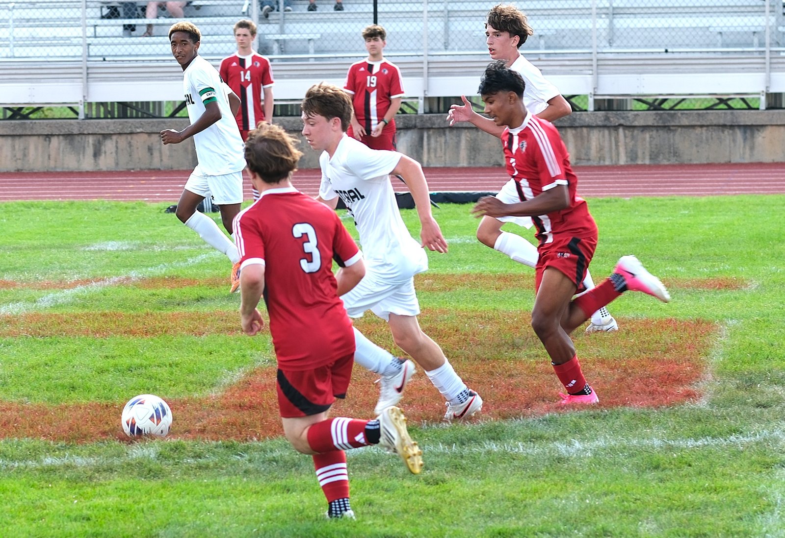 Central boys' soccer players battling for the ball